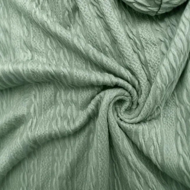 Green women's hooded zipper coat with a loose fit on a hanger.