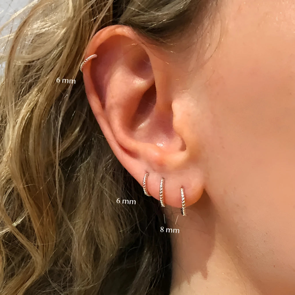 Twisted string round ring earrings in sterling silver with gold plating