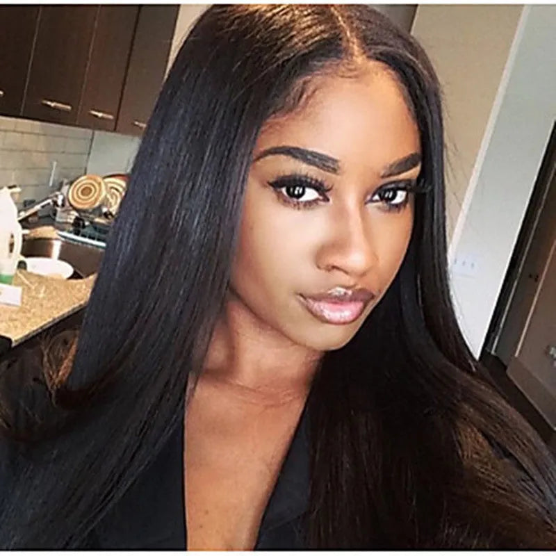 Long straight black synthetic wig with centre-parted bangs on a wig stand