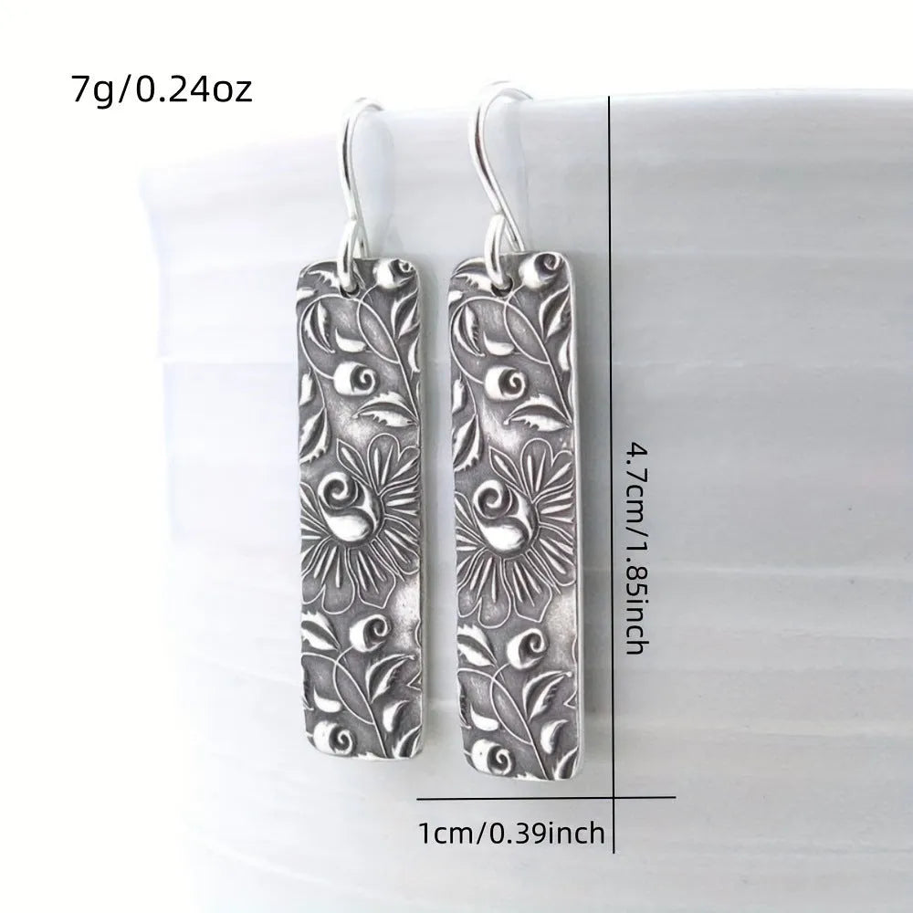 Silver geometric long earrings with carved vine design in retro style