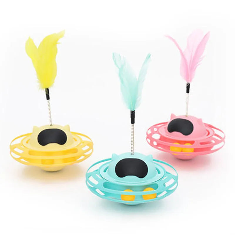 Pink cat stick toy with rotating tumbler turntable measuring 17cm by 10cm