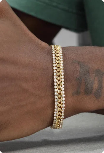 Gold-coloured titanium steel tennis bracelet with artificial gemstone inlay and a clasp.