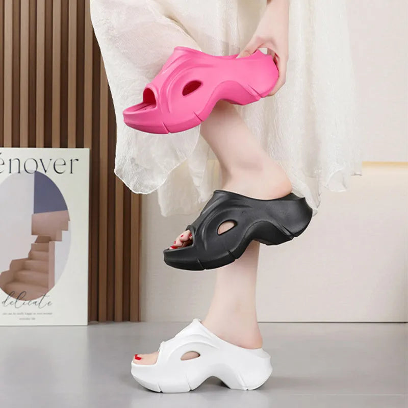 Women's white thick-soled EVA slippers with round toe for beach wear.
