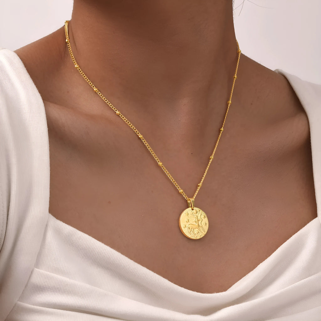 Stainless steel zodiac constellation bead necklace with embossed designs and cross chain