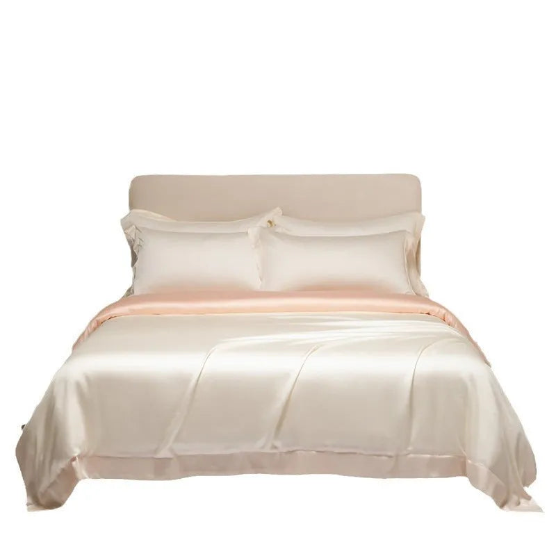 200 thread count Lenzing Tencel quilt cover and sheet set in Aurora Blue, laid on a bed.