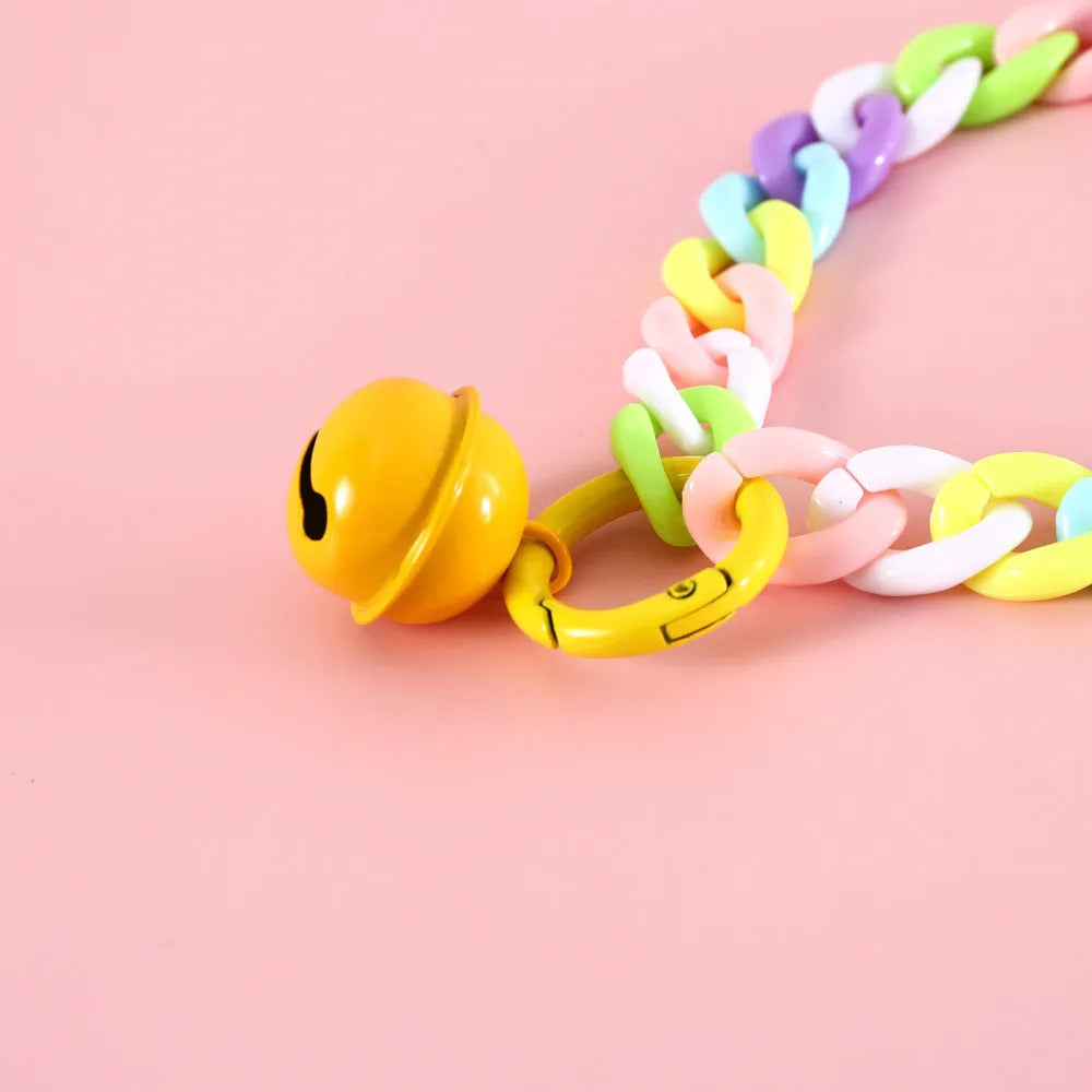 Macaron candy colour plastic collar for pet dog cat rabbit on a blue background.
