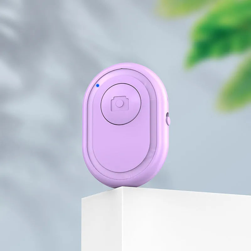 Wireless Bluetooth remote self-timer for smartphones in black, pink or purple colour options