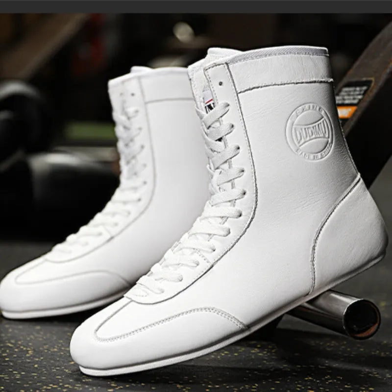 Professional black and gold mesh boxing shoe for indoor wrestling and training.