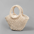 Hand-woven maple beach handbag with wooden beads in dumpling shape, shown in milky white colour