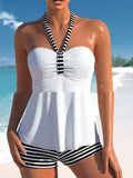 Women's off-shoulder swimsuit with black and white stripes on solid colour background