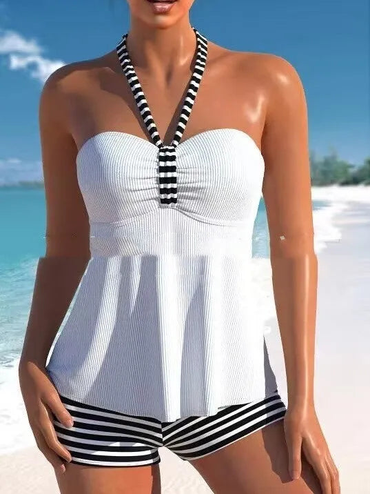 Women's off-shoulder swimsuit with black and white stripes on solid colour background