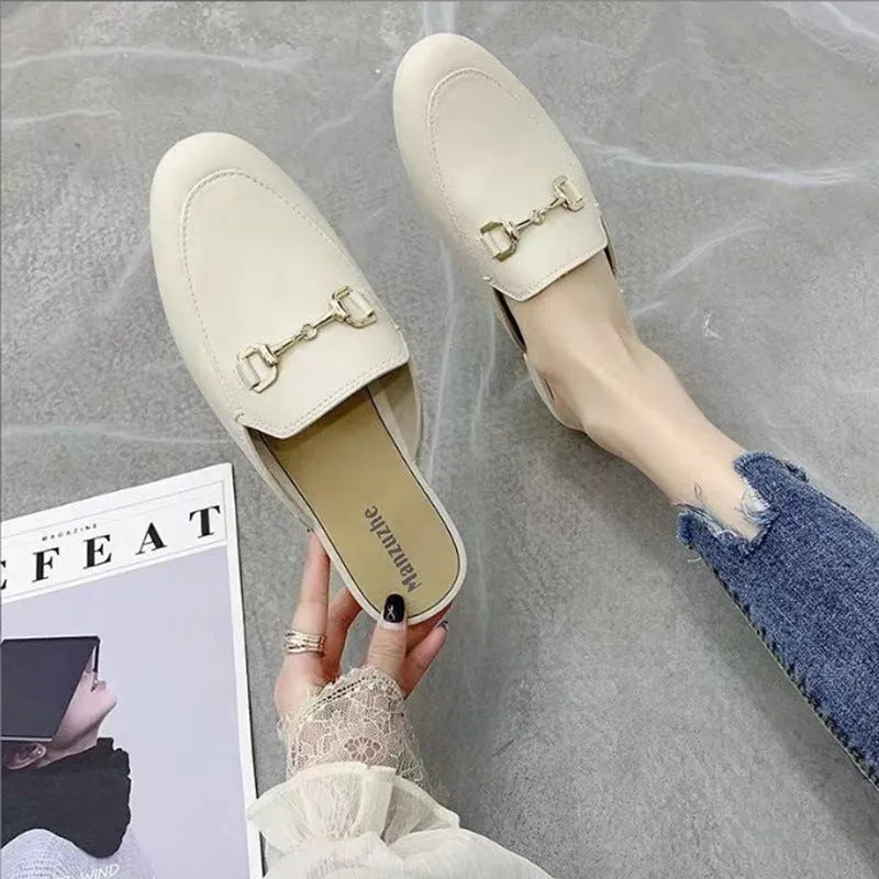 Women's PVC closed-toe half slippers with metal buckle in choice of colours.
