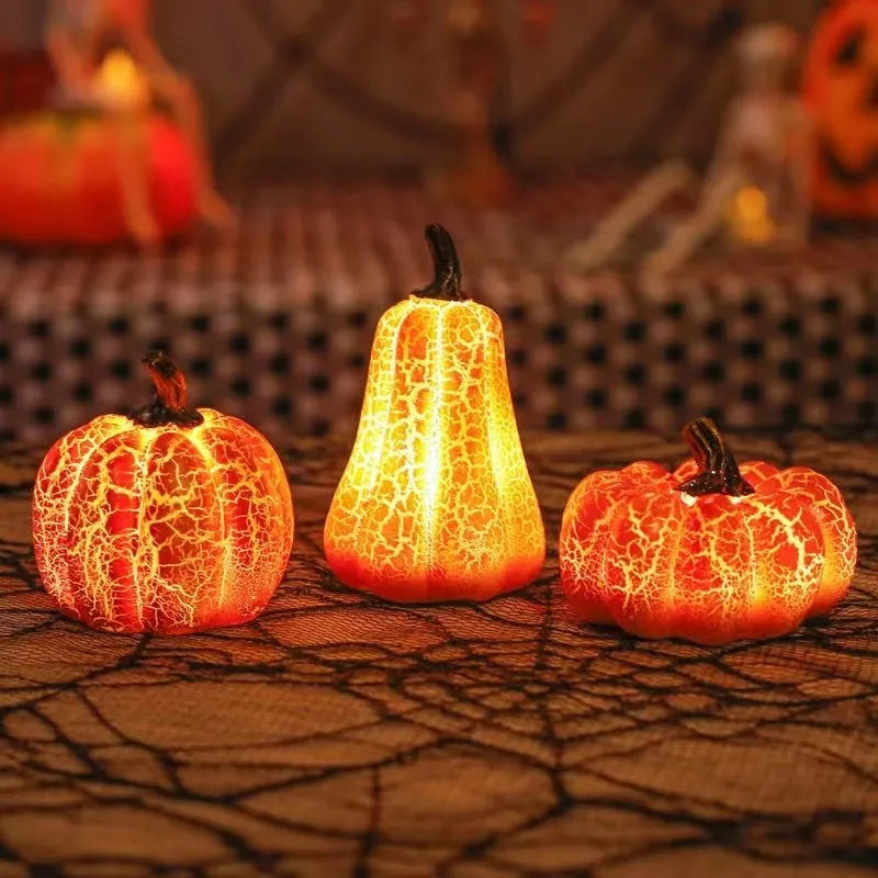 Three Halloween pumpkin lanterns in short, medium, and long sizes with LED illumination and realistic surface cracks
