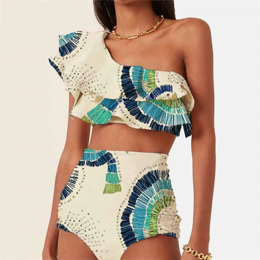 White women's one-shoulder swimsuit with a layered lotus leaf design skirt and high leg split.