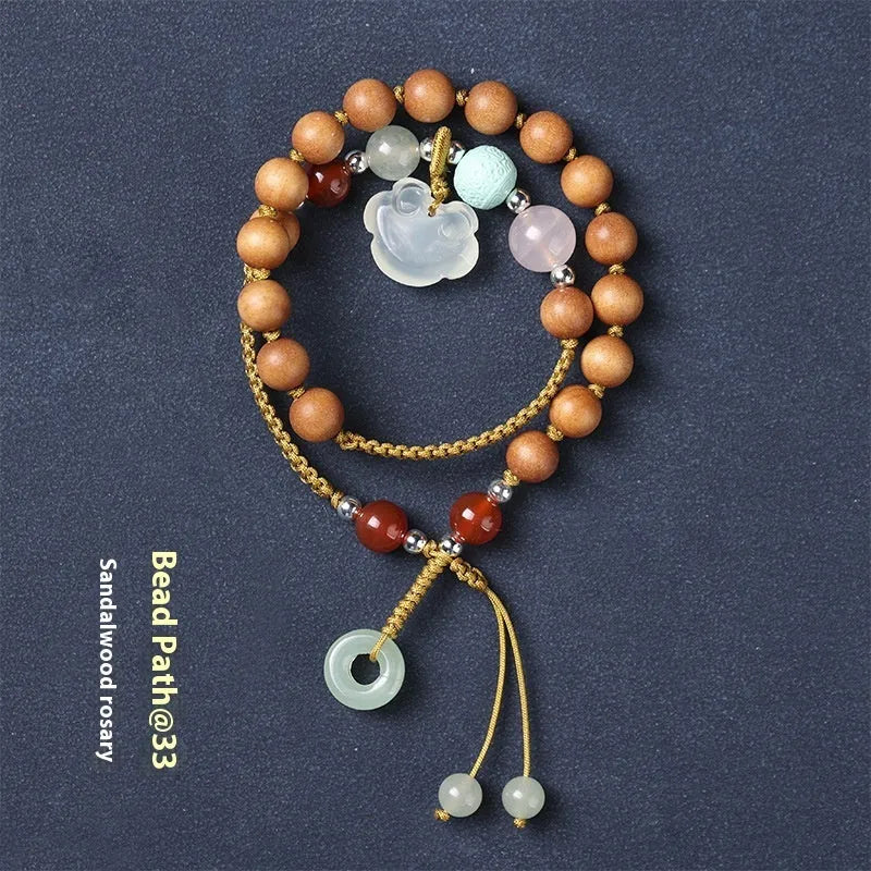 Hand-woven women's ebony bracelet with sandalwood fragrance and traditional double ring design