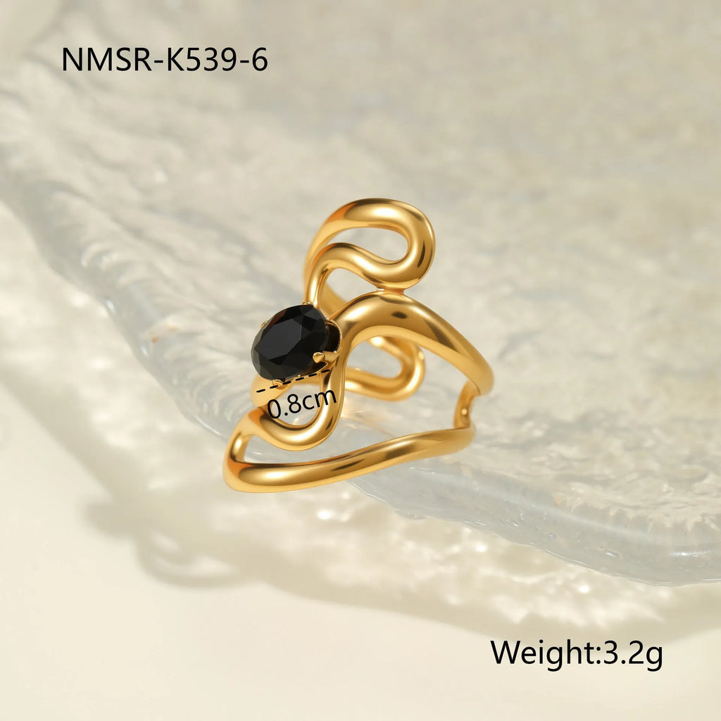 Geometric open mouth titanium steel ring for women with zircon inlays on a grey background