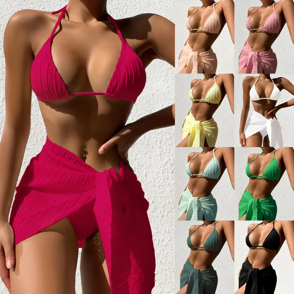 Women's halterneck bikini set in a solid colour with a mesh skirt, showing backless design.