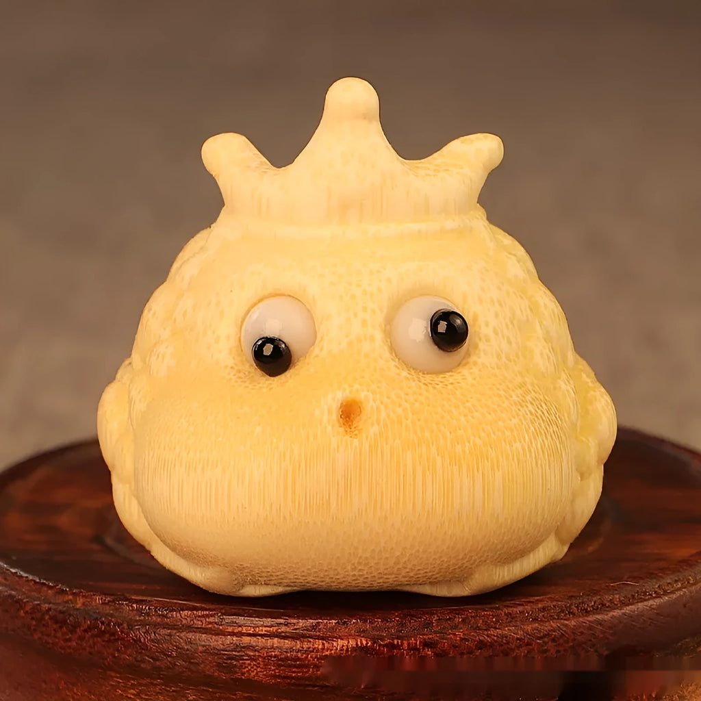 Solid bamboo carving of a Crown Princess toad ornament with live eye detail in a cute style.