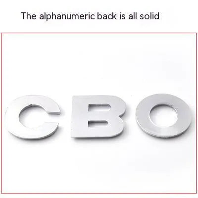 3D metal zinc alloy car letter sticker in black or silver, shown actual size at 2.5cm.