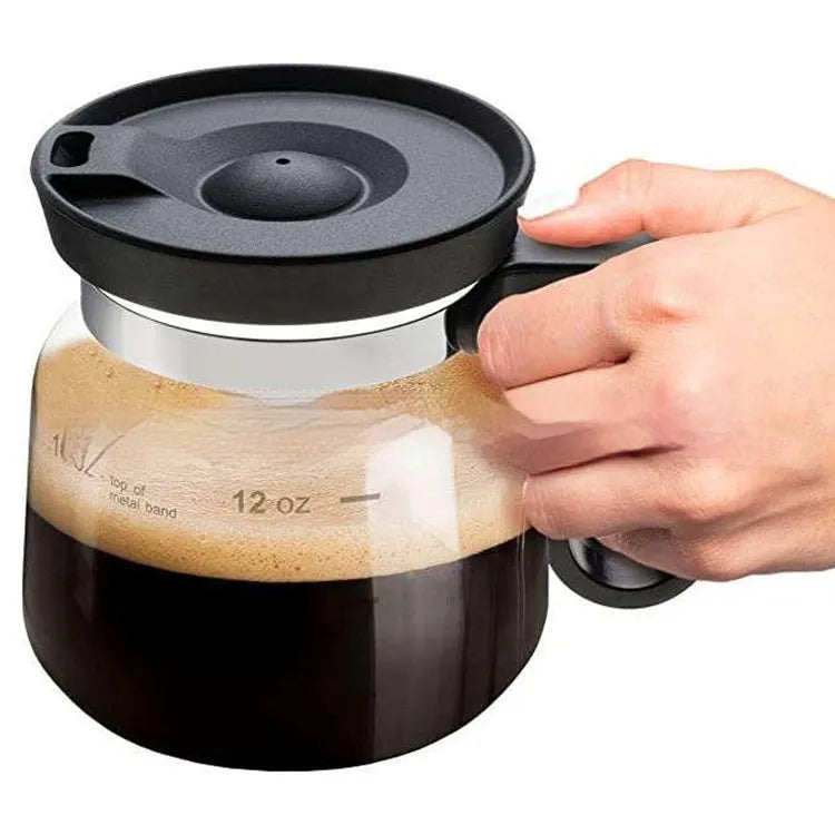 Transparent borosilicate glass coffee maker with silicone cover showing modern simplicity design