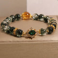 Gold rutilated quartz women's bracelet with green phantom quartz, ruby quartz beads and crystal accents