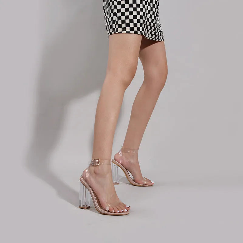 Women's apricot high heel sandals with clear glass heel and buckle strap.