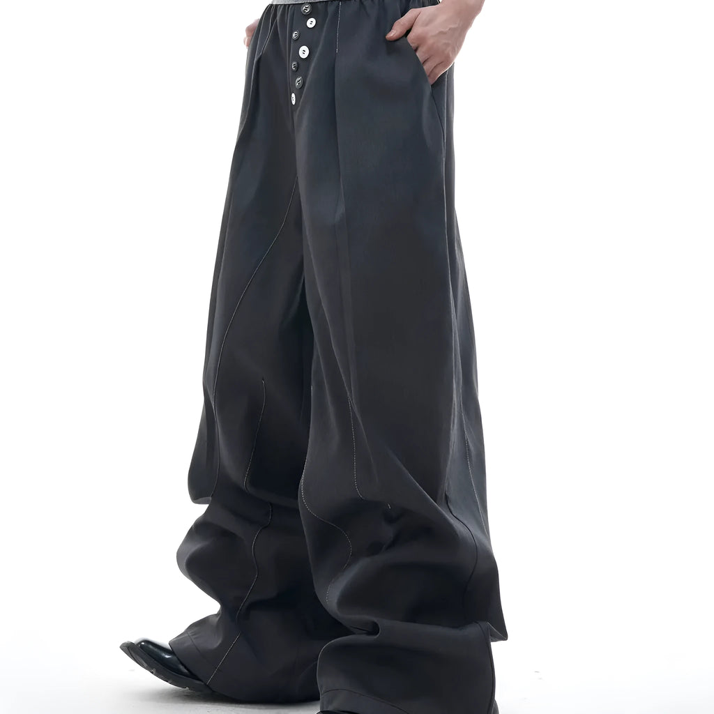 Black high-waisted straight-leg casual trousers featuring a button-open line design detail on the leg.