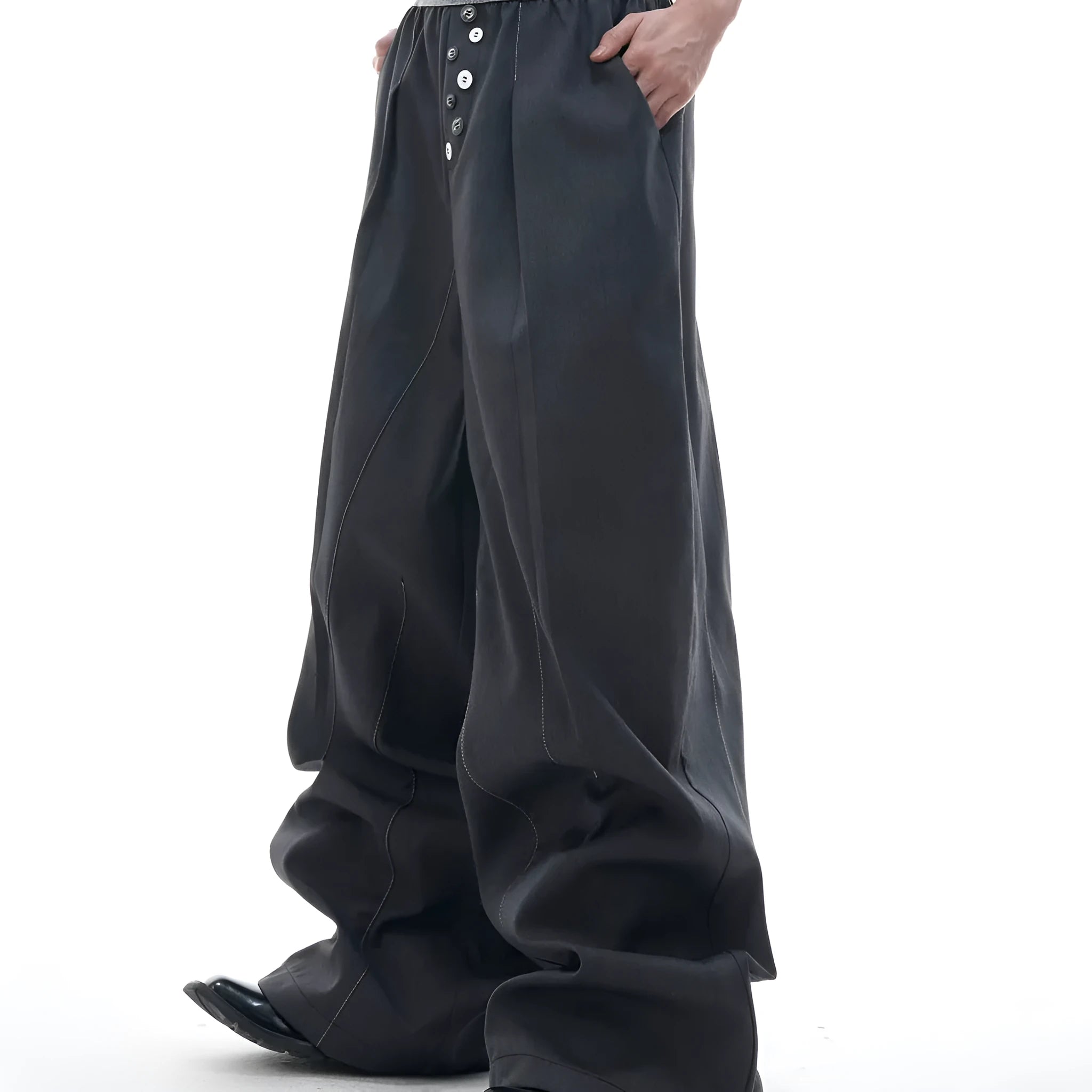 Black high-waisted straight-leg casual trousers featuring a button-open line design detail on the leg.