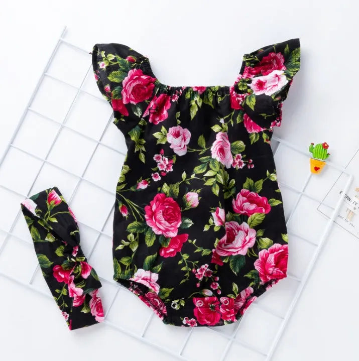 Baby girl wearing black cotton sleeveless romper with triangle climbing style