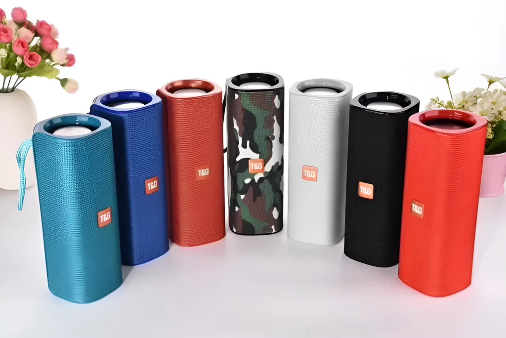 Cloth-covered wireless Bluetooth speaker in multiple colours showing front with speaker grilles