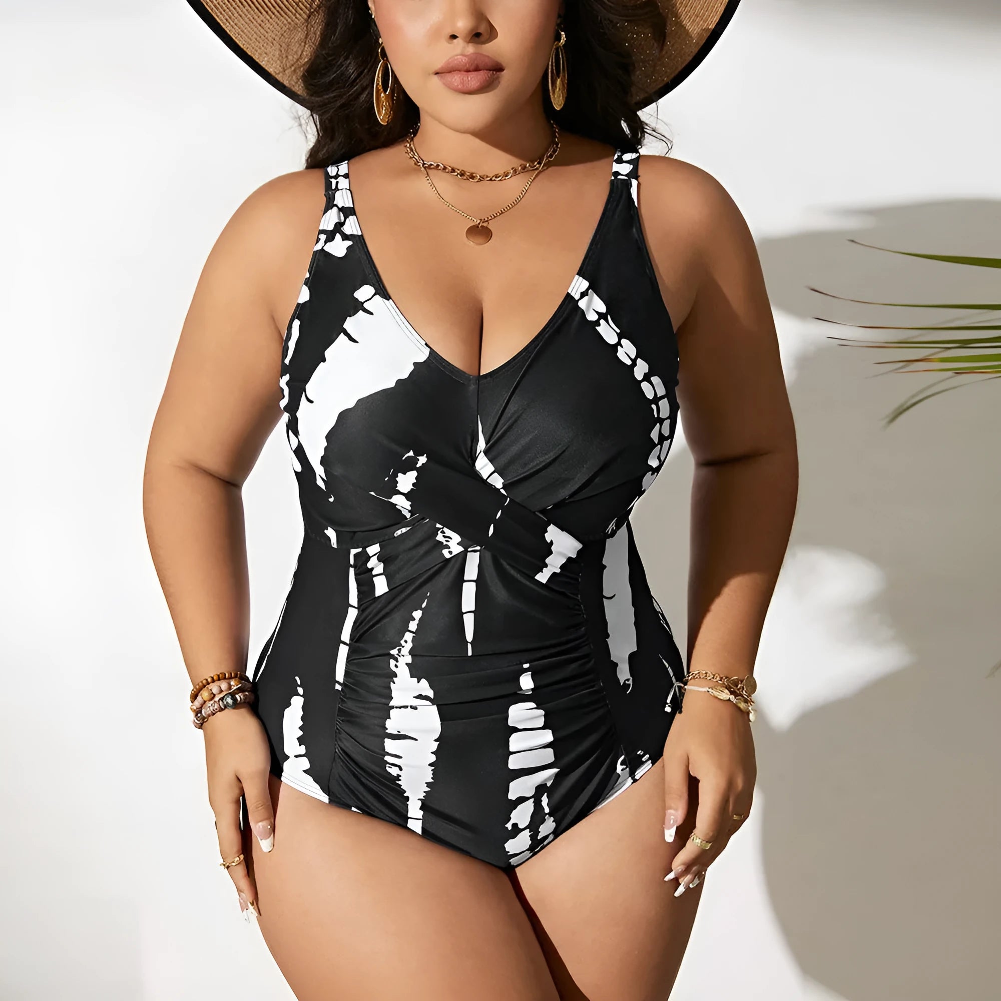 Black Siamese colour matching fit one-piece swimsuit on a hanger.