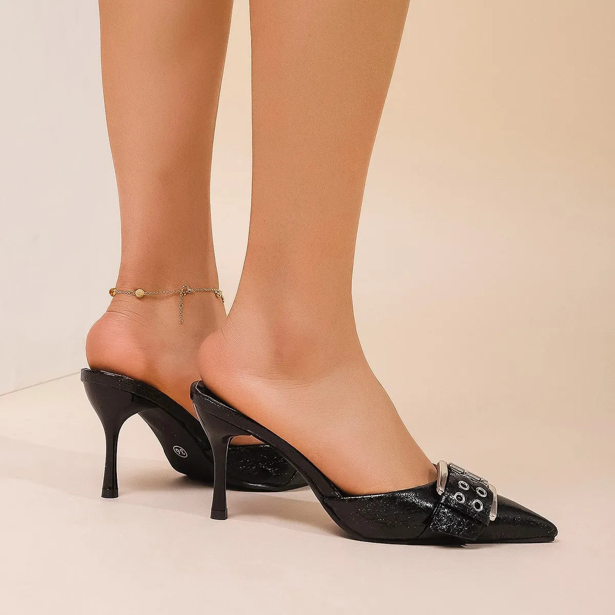 Black women's pointed toe high heels with ankle strap and buckle decoration