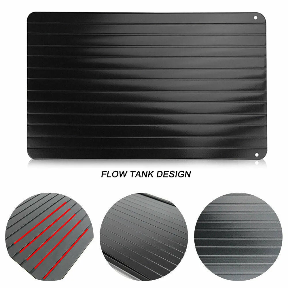 Black aluminium fast defrosting tray for thawing frozen meat and food.