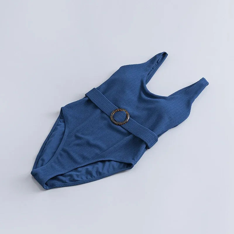 Navy blue women's one-piece slimming swimsuit with triangle neckline and removable chest pad.