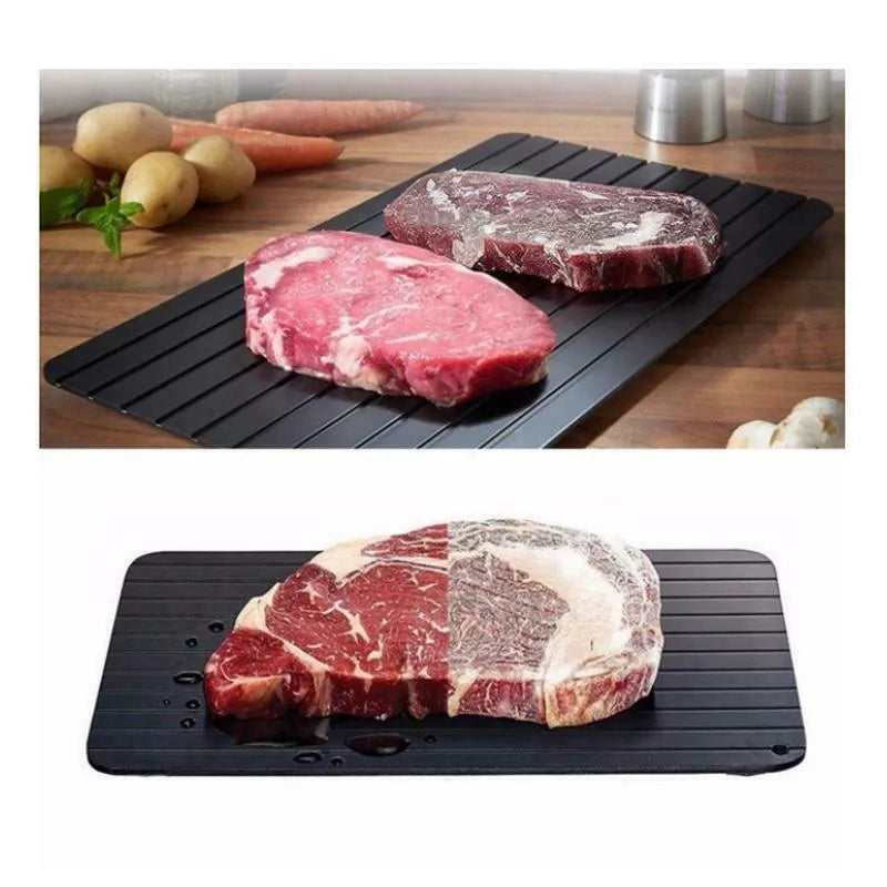 Black aluminium fast defrosting tray for thawing frozen meat and food.