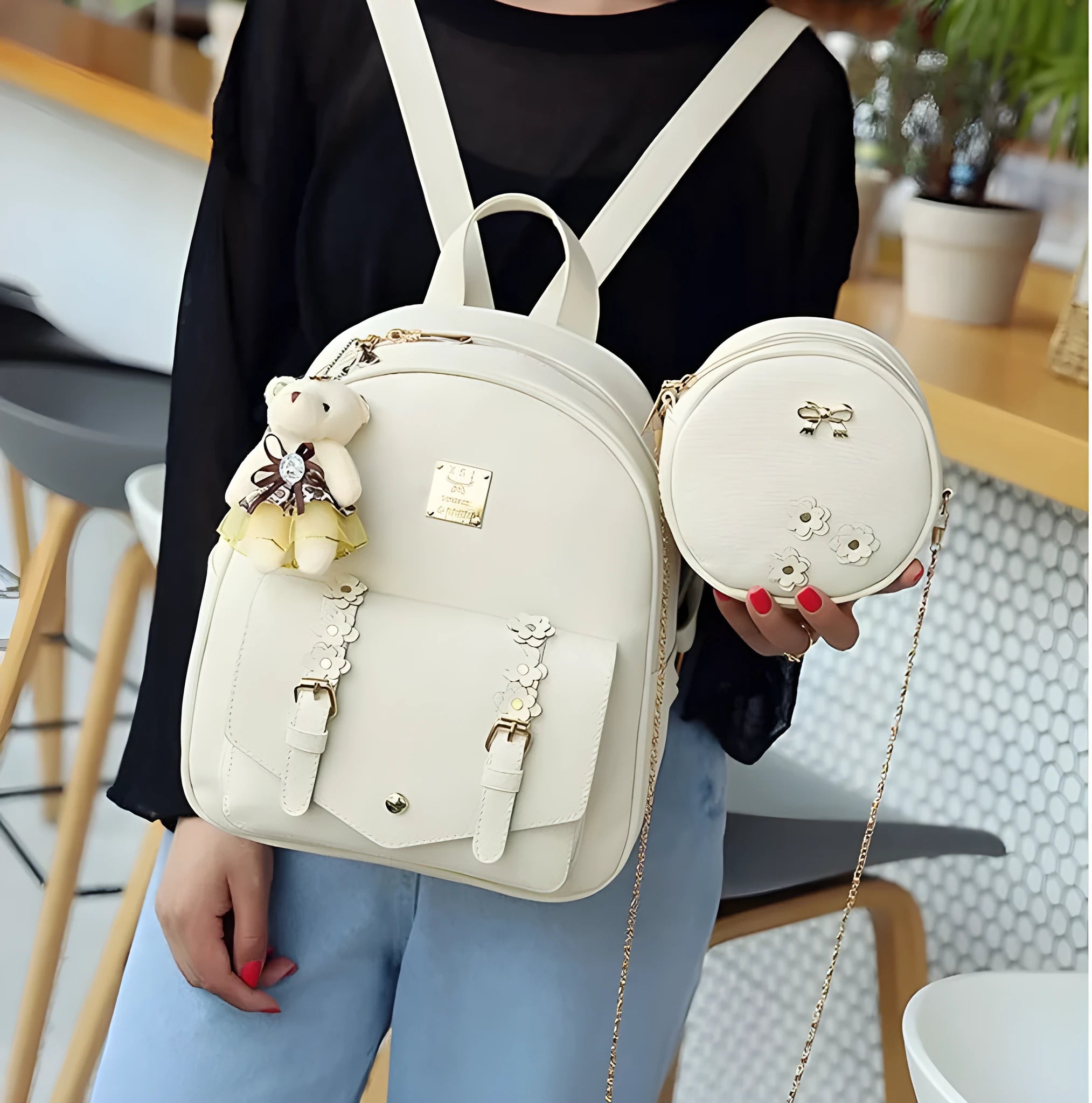 Women's 3-piece floral print PU leather bag set showing backpack, shoulder bag, and card purse in pink.