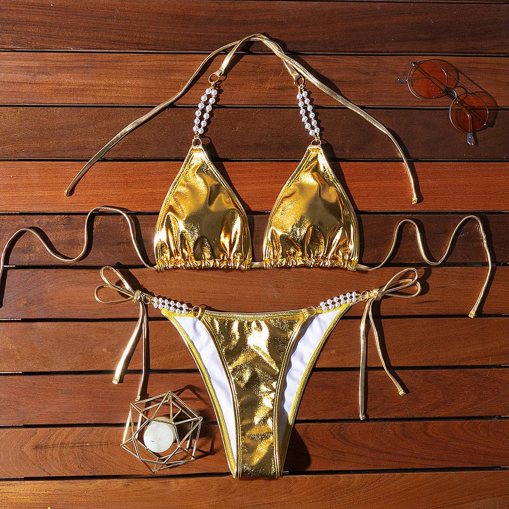 Gold halter bikini with lace-up front and pearl chain detail, brief cut swimsuit