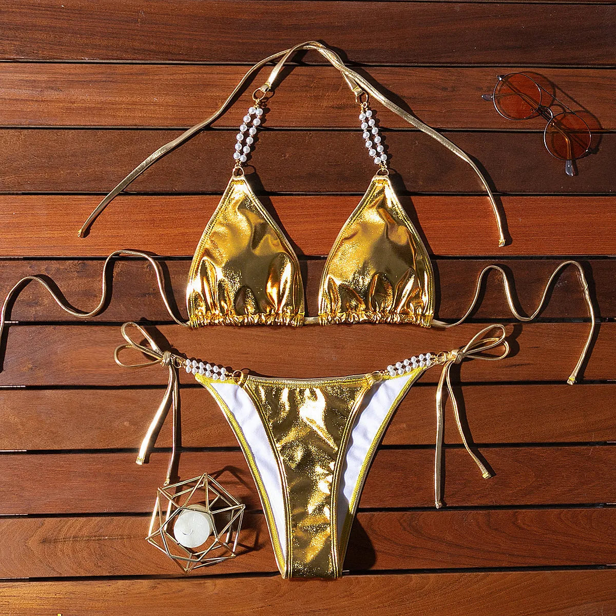 Gold halter bikini with lace-up front and pearl chain detail, brief cut swimsuit