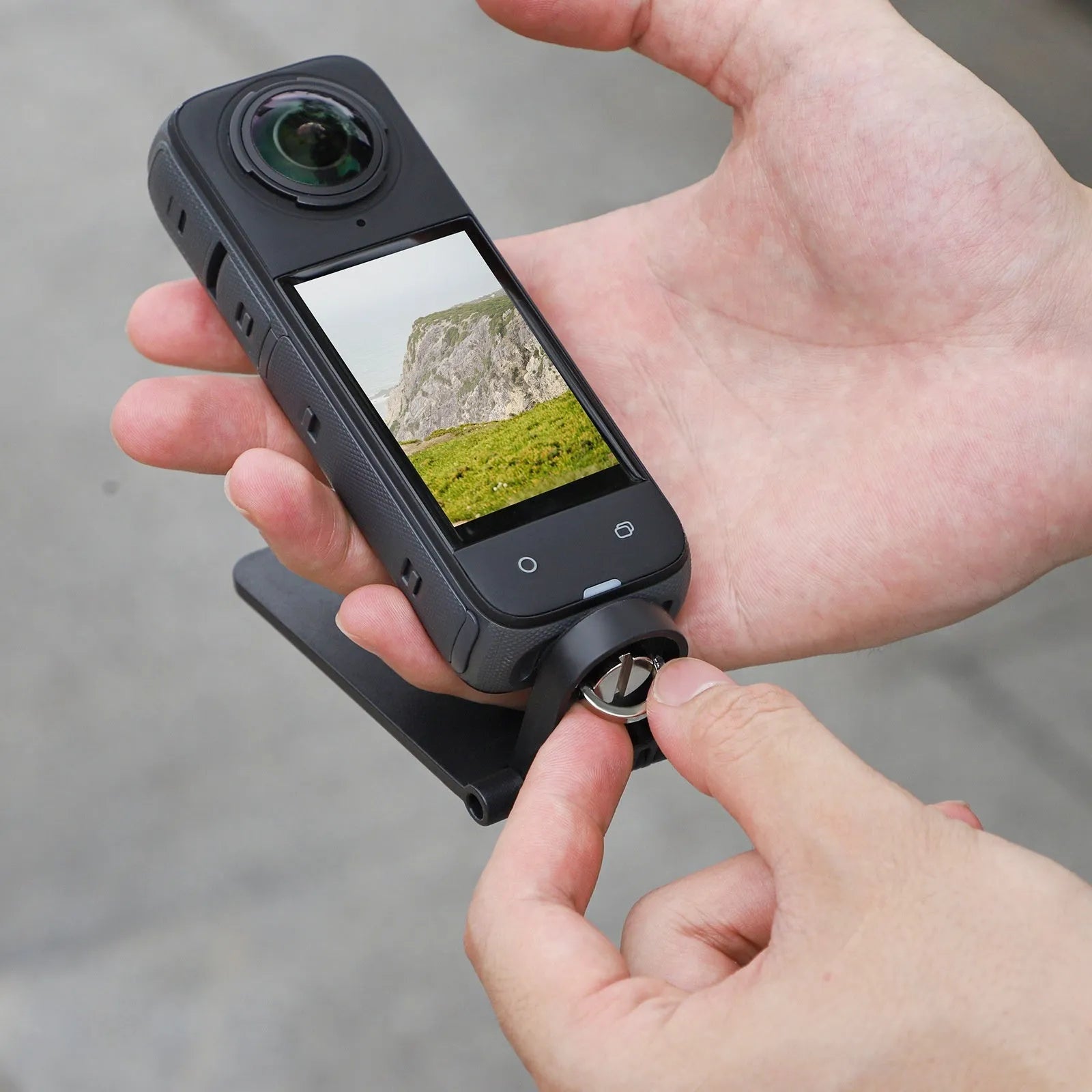 Black magnetic bracket base handle for Insta360 X4 camera with angle adjustment mechanism