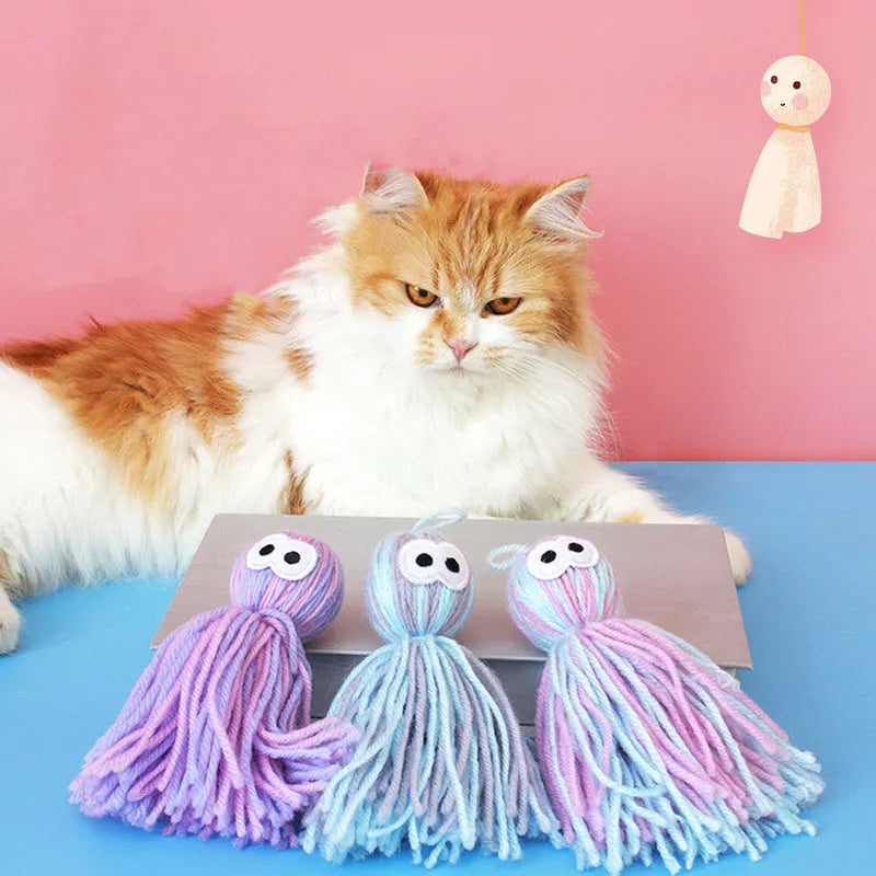 Wool ball cat toy in pink and blue colours with hanging attachment