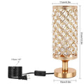 Modern crystal table lamp with hollow-carved design, metal base, gold finish, push button switch, on bedside table