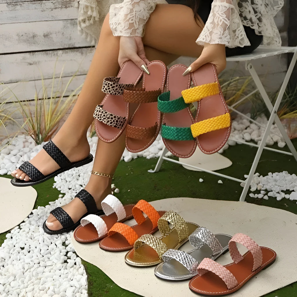 Plus size women's woven beach slippers in gold colour with a synthetic leather upper and PVC sole.