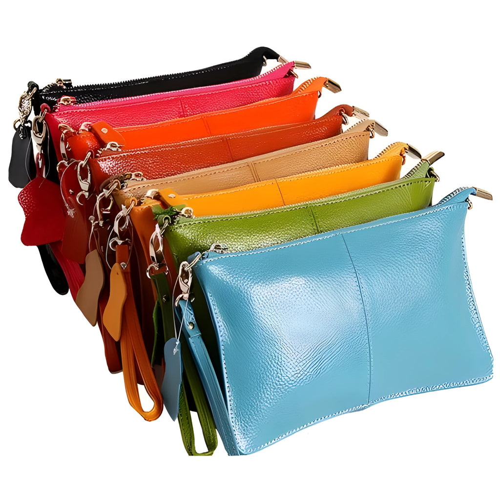 Lady's cowhide slant handbag with a hand strap and long shoulder strap shown in a selected colour.