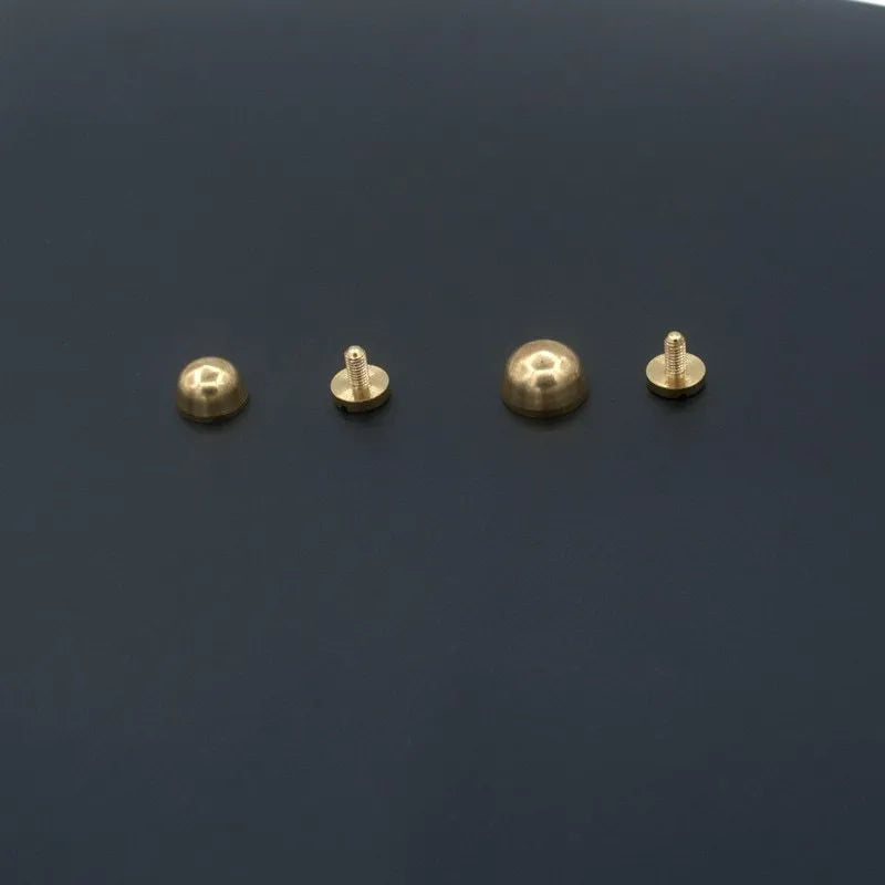 Brass decorative buckle and foot nail jewellery findings in 10x6mm and 12x7mm sizes.