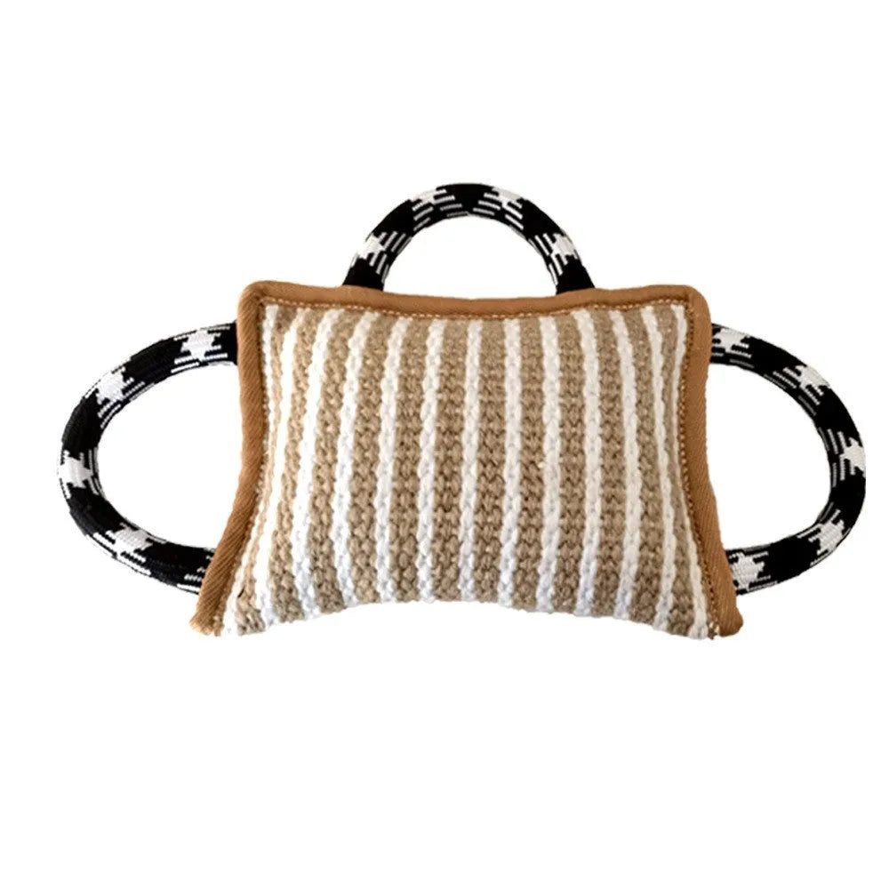 Blue dog tug toy with jute bite pillow and three rope handles for tug of war.