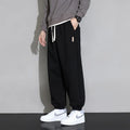Men's loose fit cotton-polyester sports trousers in grey with elasticated waistband