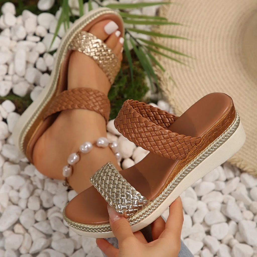 Gold wedge sandals for women with an adjustable ankle strap and a rubber sole.