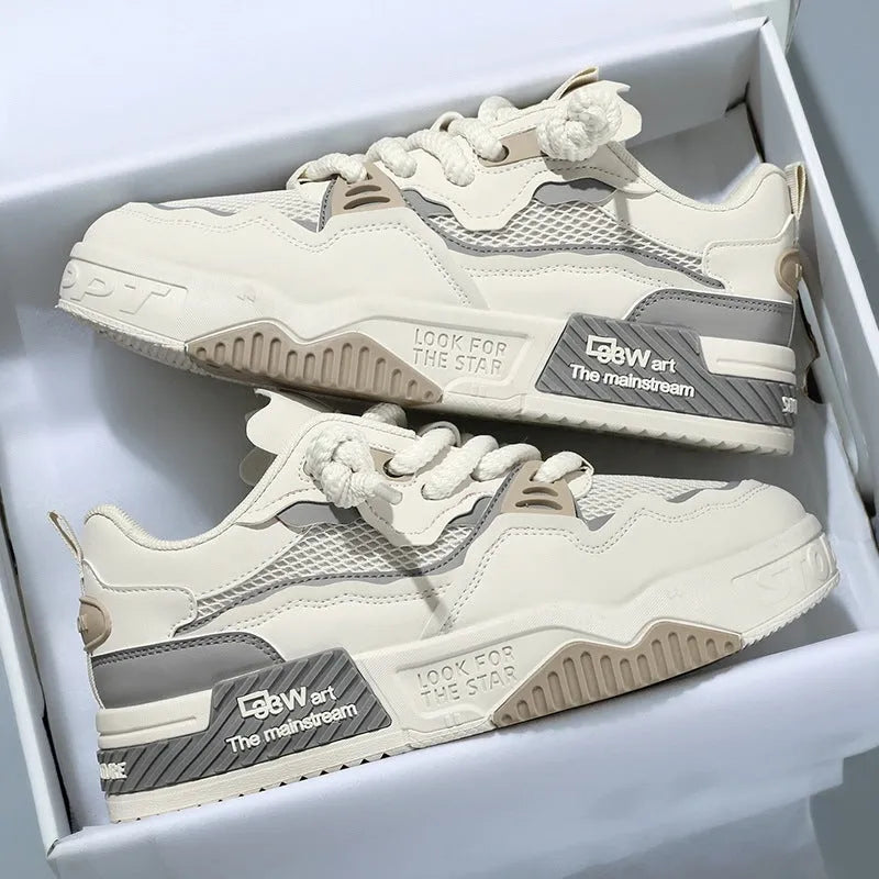Men's low-top white and beige board shoes with a soft rubber sole and mesh lining.