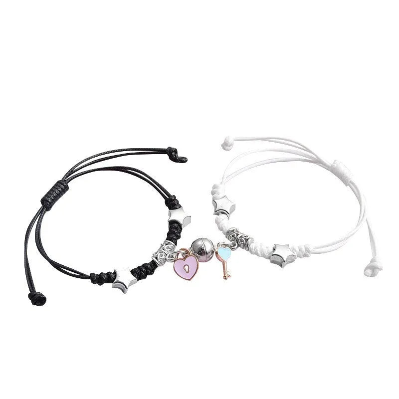 Couple suction bracelet pair showing electroplated alloy construction with crown pendant design