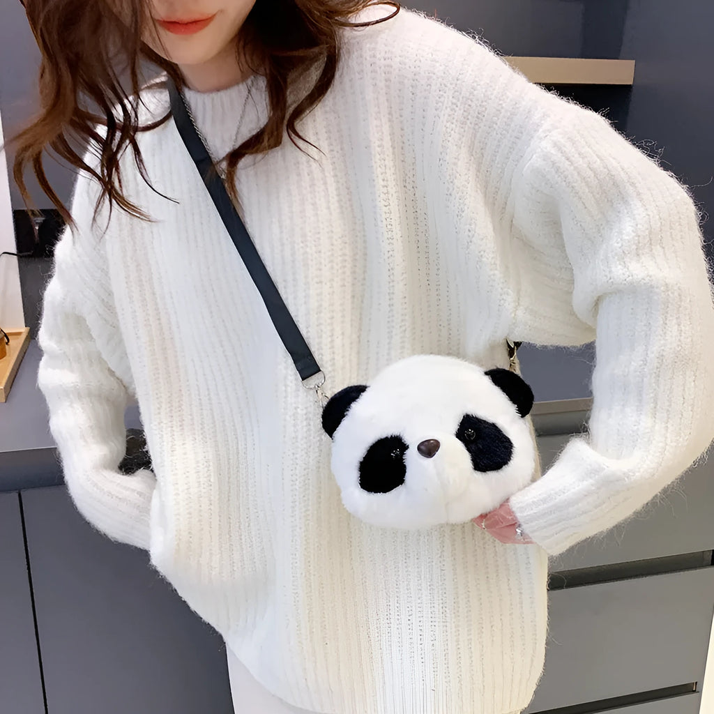 Soft plush cylindrical crossbody bag in panda head design with a sandwich pocket.